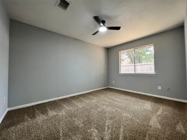 a bathroom with a double vanity sink a mirror and a bathtub