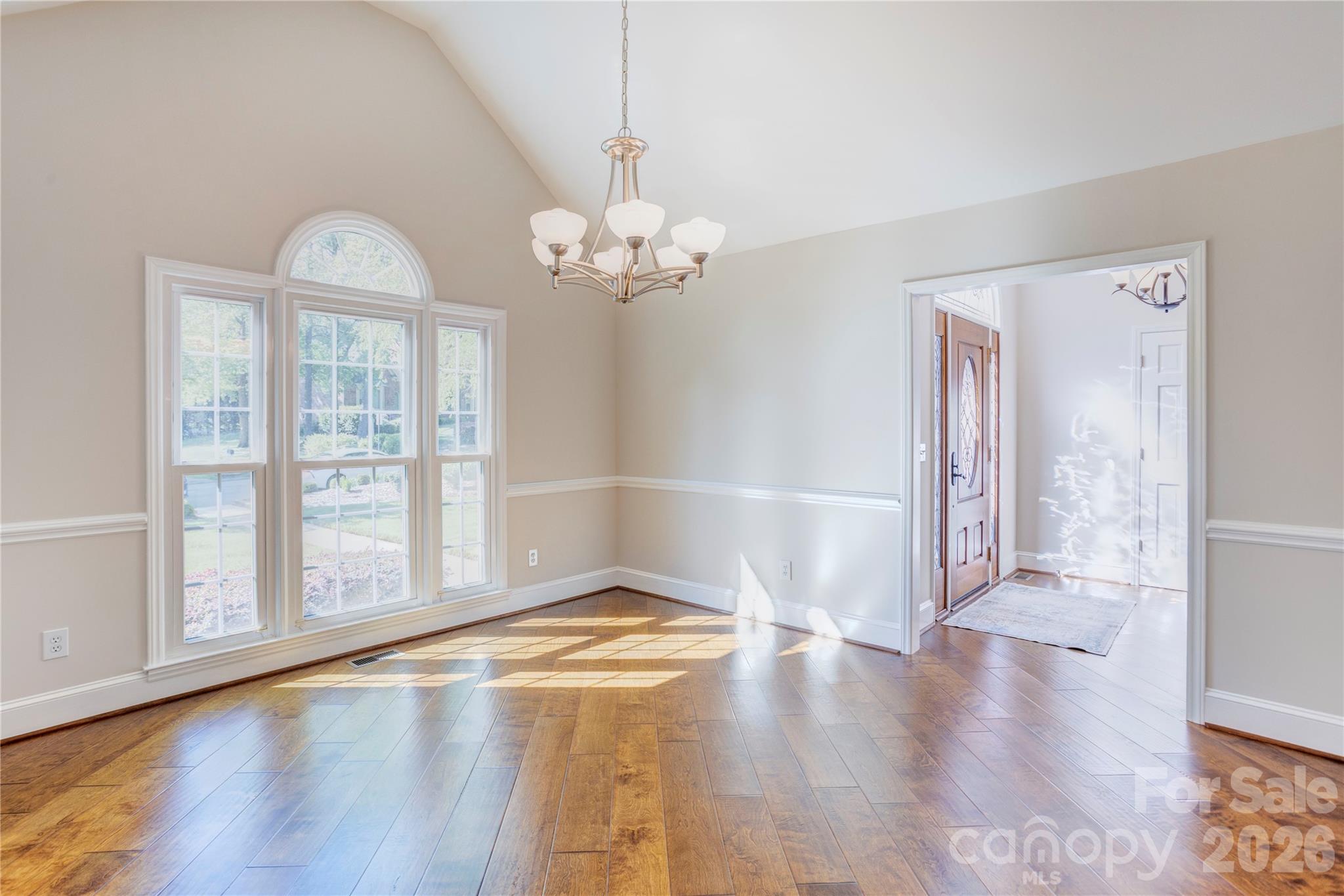 1188 Fawn Ridge Road Northwest Concord, NC 28027 - Photo 10 of 38 a view of an empty room with wooden floor and a window