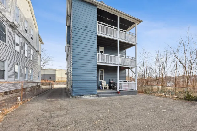 a view of a building with a yard