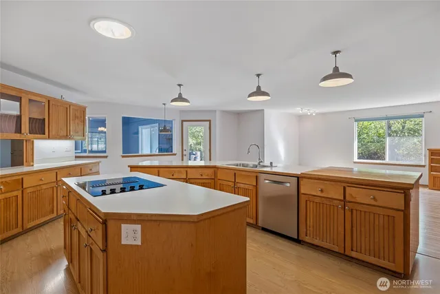 a view of a dining room with furniture and chandelier