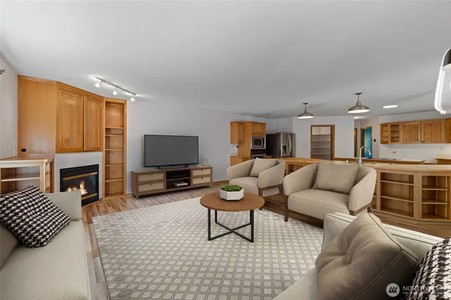 a view of a livingroom with furniture and an empty room