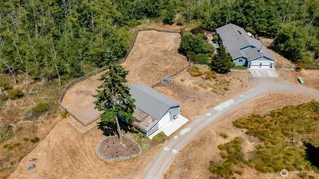 an aerial view of a house with outdoor space