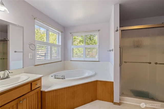 a view of a room with wooden floor and white walls