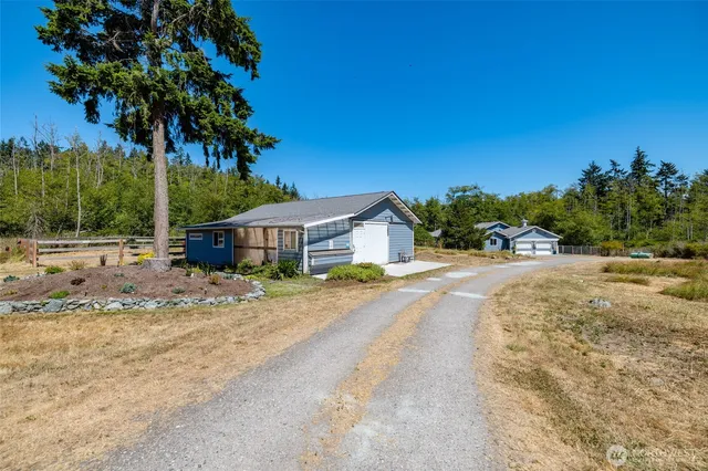 a house with trees in the background