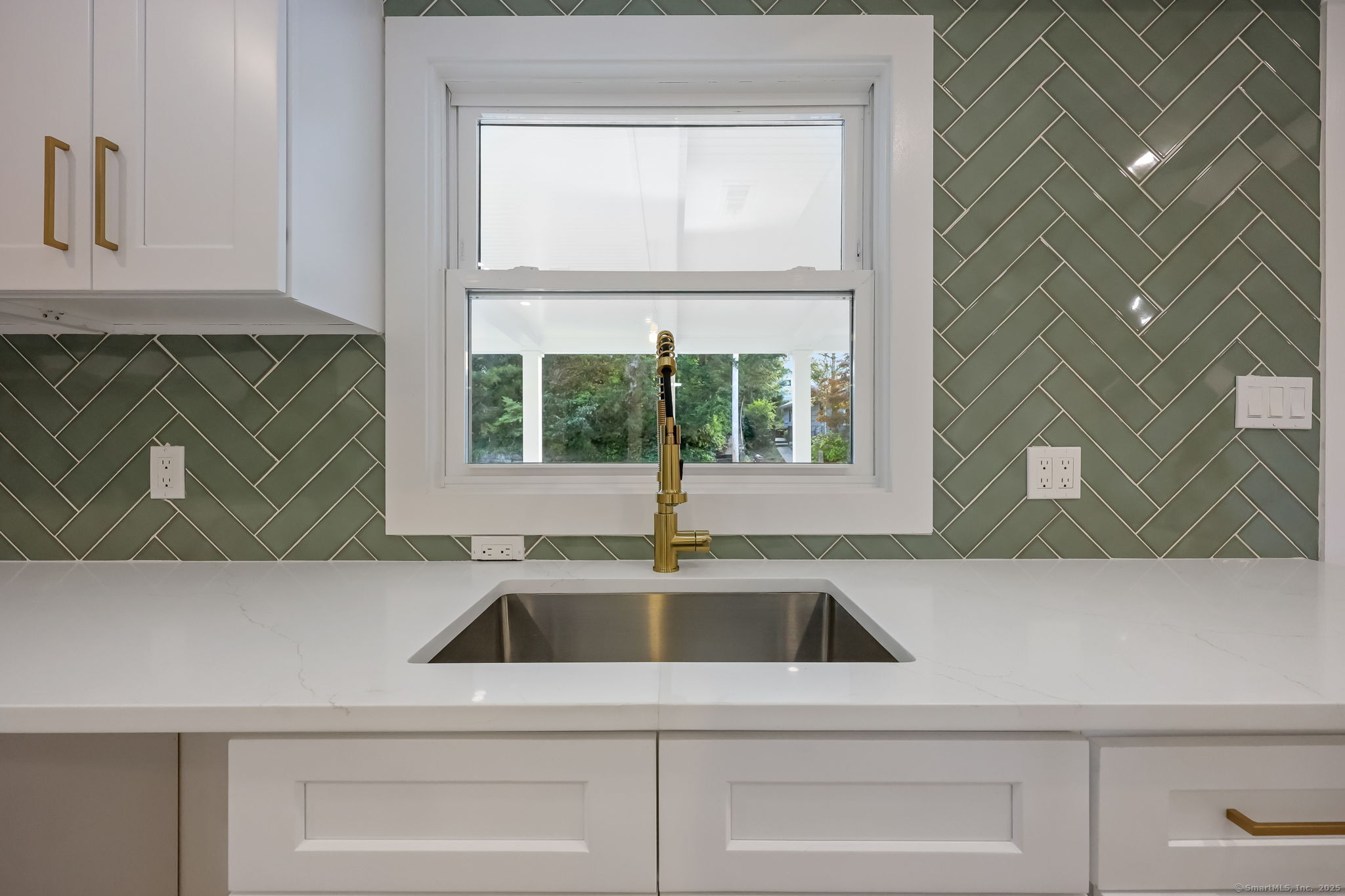 294 Thimble Island Road Branford, CT 06405 - Photo 12 of 39 a kitchen with a sink and cabinets
