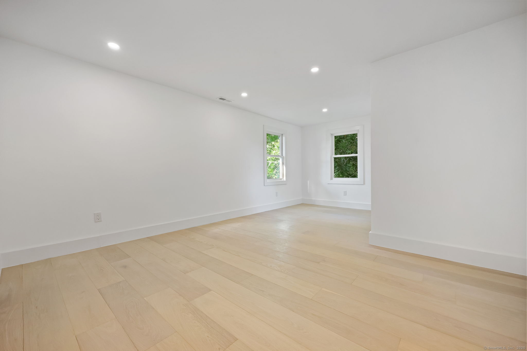294 Thimble Island Road Branford, CT 06405 - Photo 18 of 39 an empty room with windows and closet