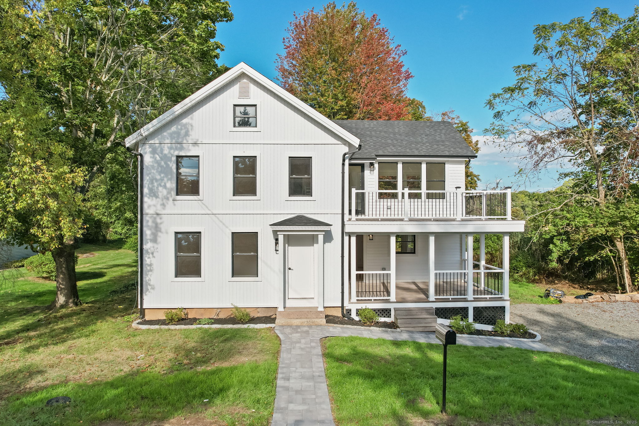 294 Thimble Island Road Branford, CT 06405 - Photo 2 of 39 a front view of a house with a yard