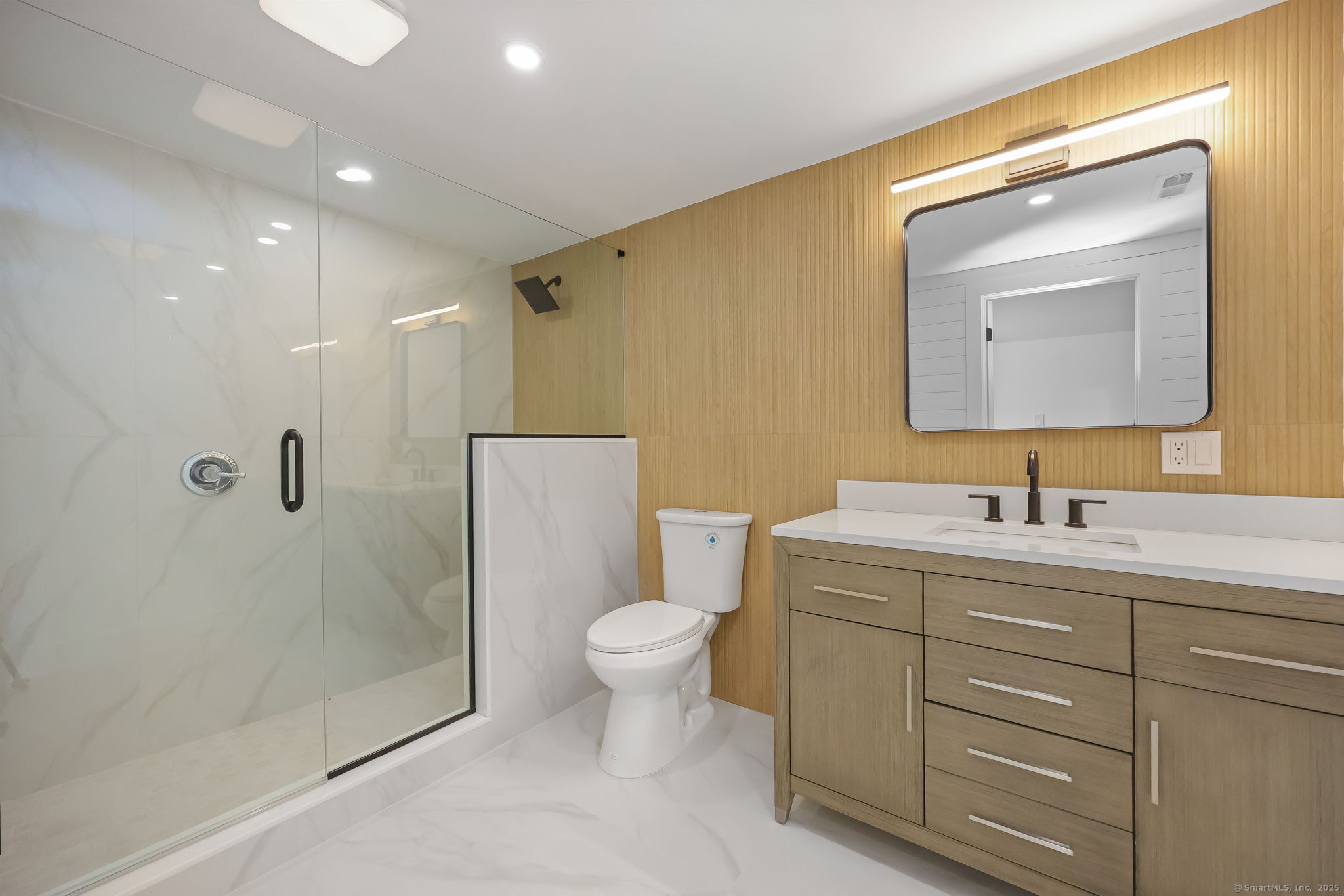 294 Thimble Island Road Branford, CT 06405 - Photo 30 of 39 a bathroom with a toilet sink and shower