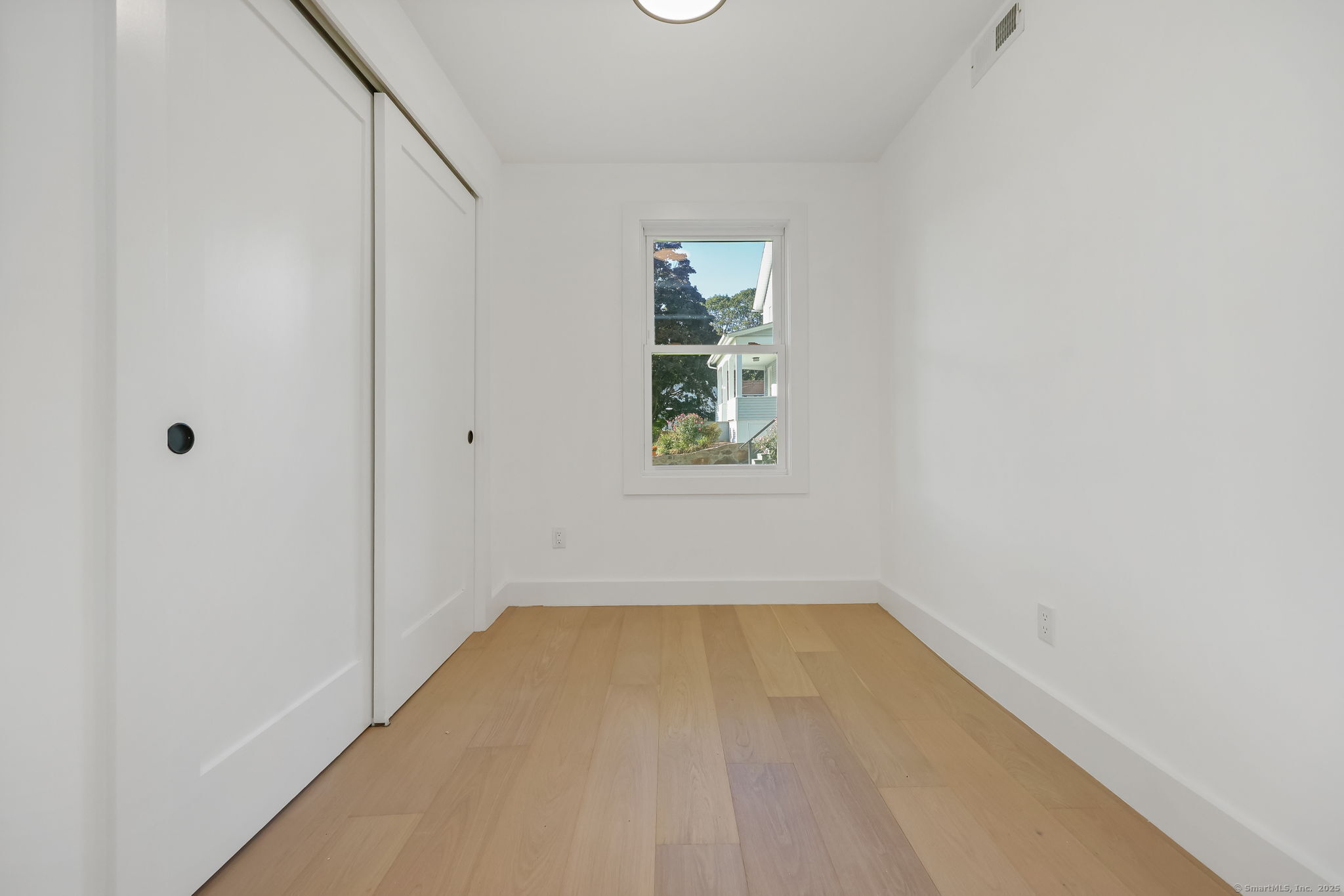 294 Thimble Island Road Branford, CT 06405 - Photo 7 of 39 a view of a room that has a window in it