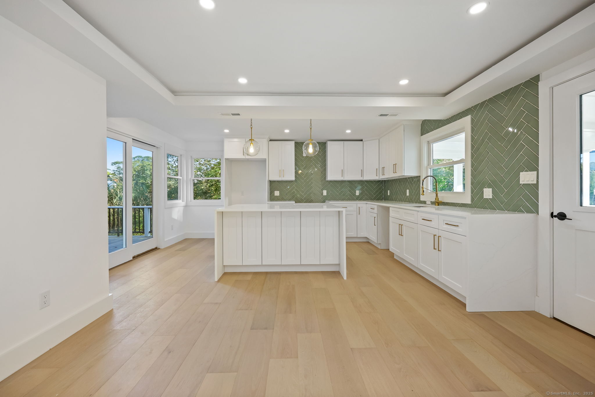 294 Thimble Island Road Branford, CT 06405 - Photo 9 of 39 a large kitchen with kitchen island a sink stainless steel appliances and cabinets