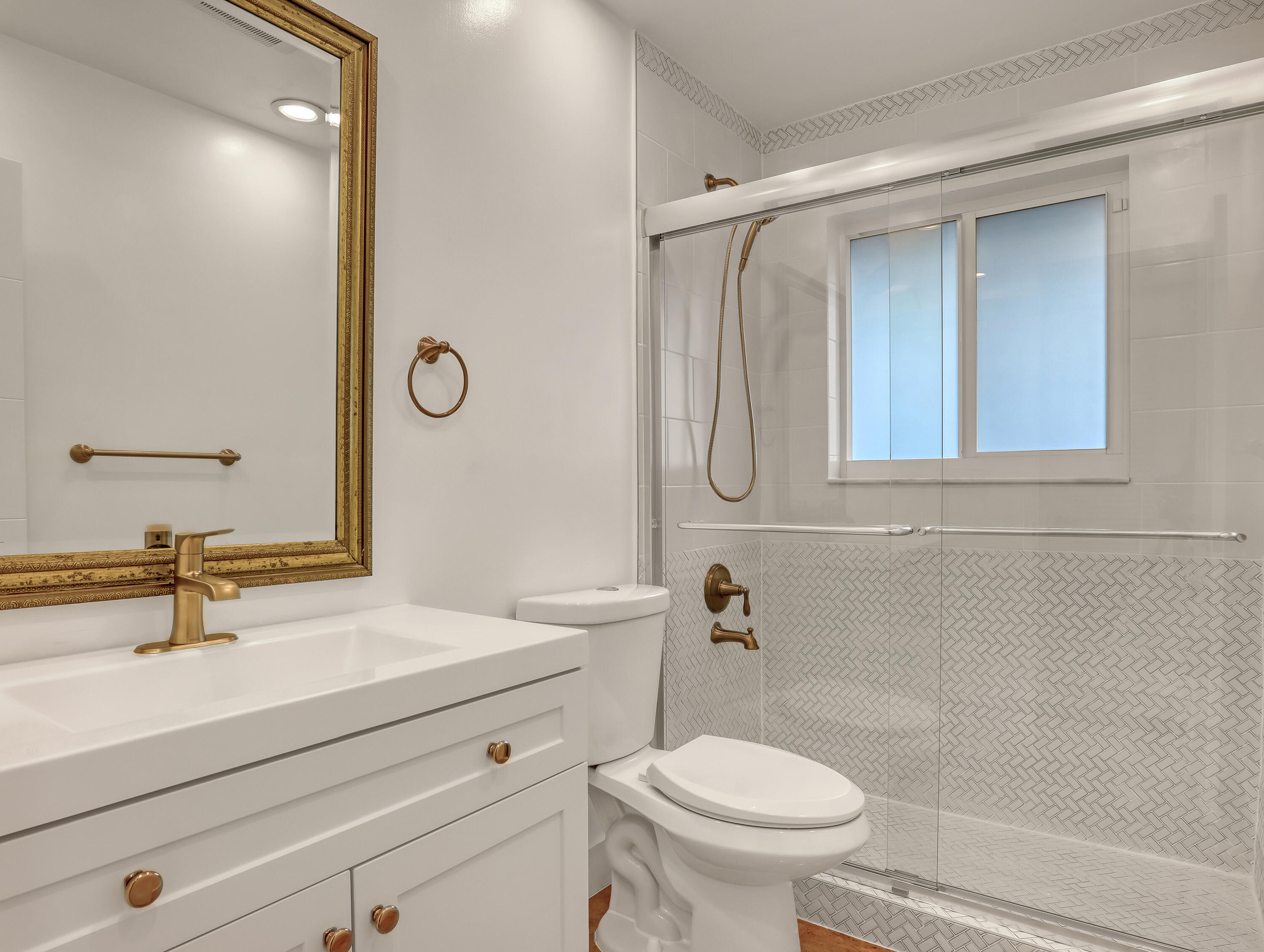 1298 Northwest 4th Street Boca Raton, FL 33486 - Photo 23 of 36 a bathroom with a sink a toilet and shower