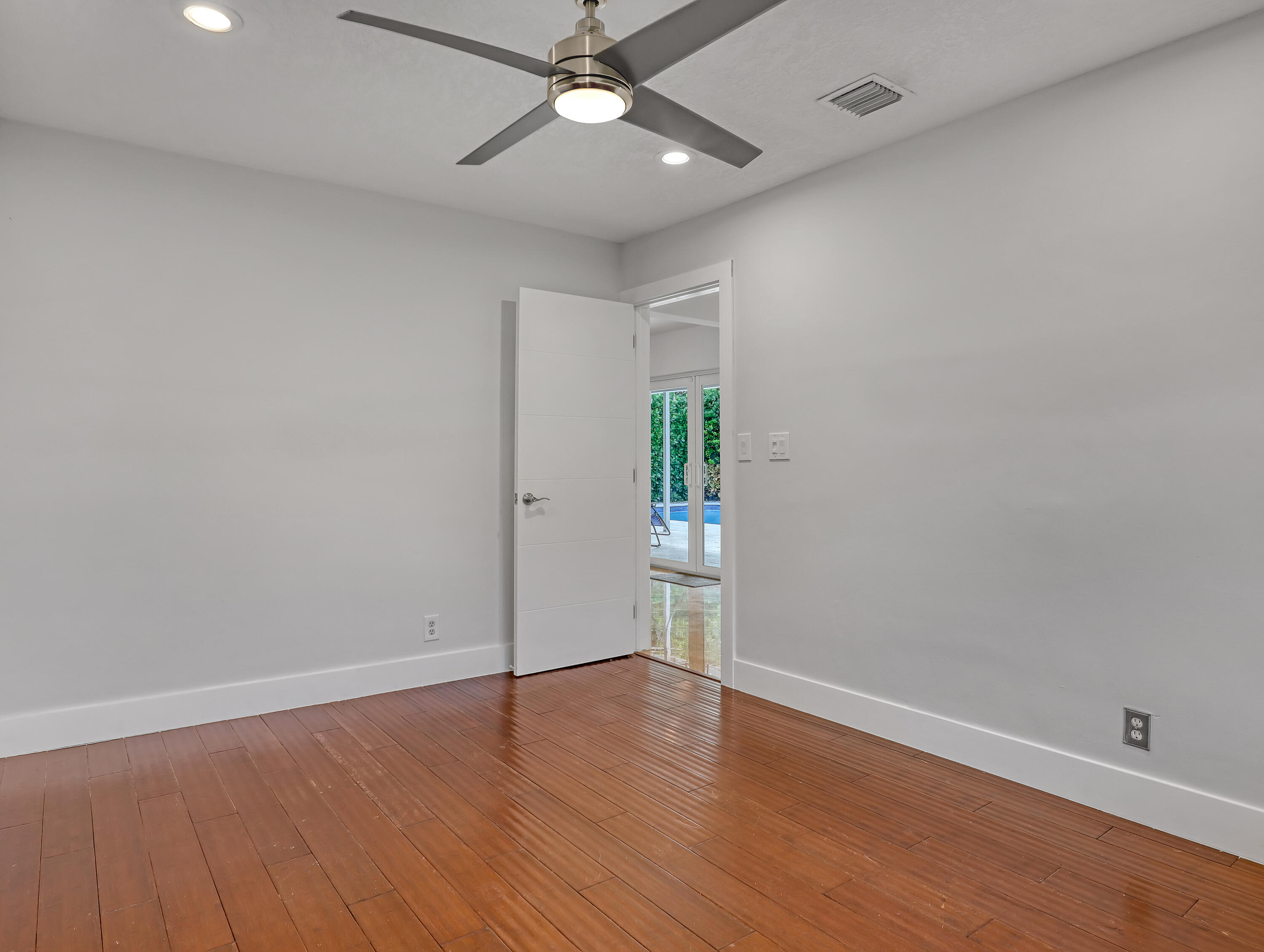 1298 Northwest 4th Street Boca Raton, FL 33486 - Photo 25 of 36 wooden floor in an empty room
