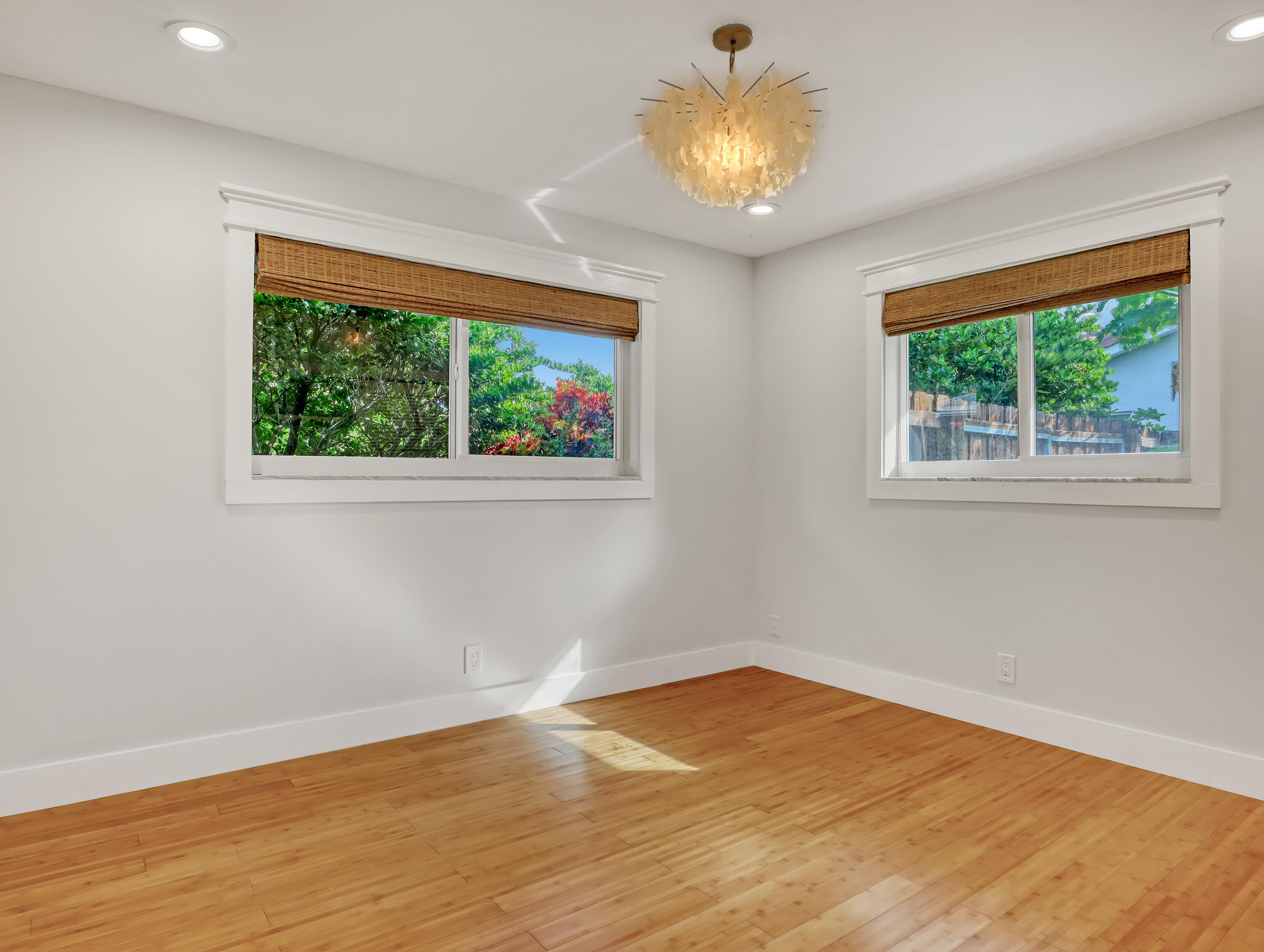 1298 Northwest 4th Street Boca Raton, FL 33486 - Photo 26 of 36 a view of empty room with wooden floor and fan