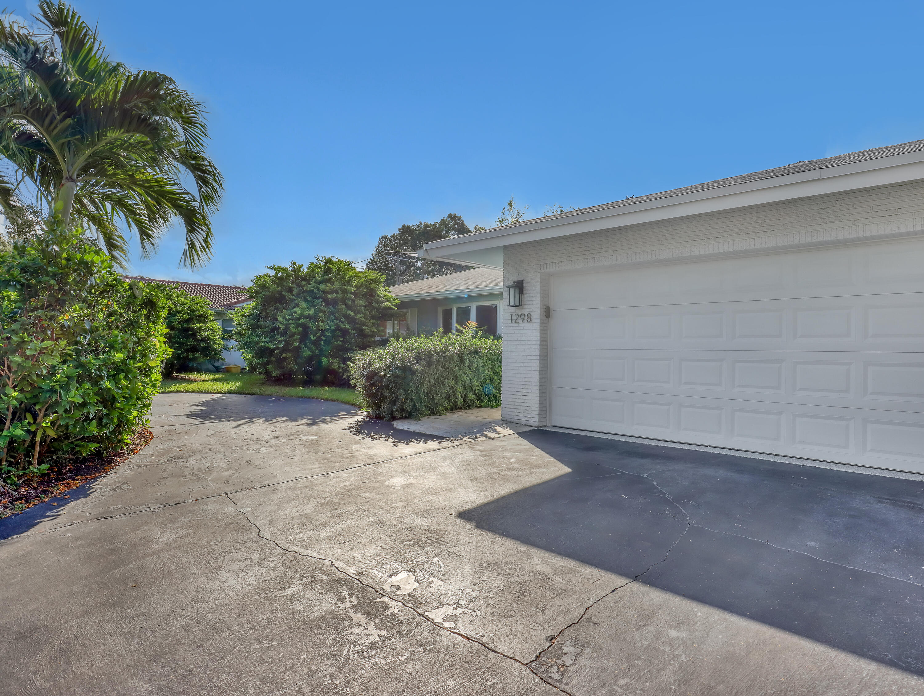 1298 Northwest 4th Street Boca Raton, FL 33486 - Photo 5 of 36 a view of a house with a yard