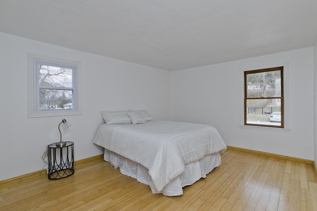 76 Paulk Terrace Springfield, MA 01128 - Photo 17 of 26 a large bed sitting in a bedroom next to a window