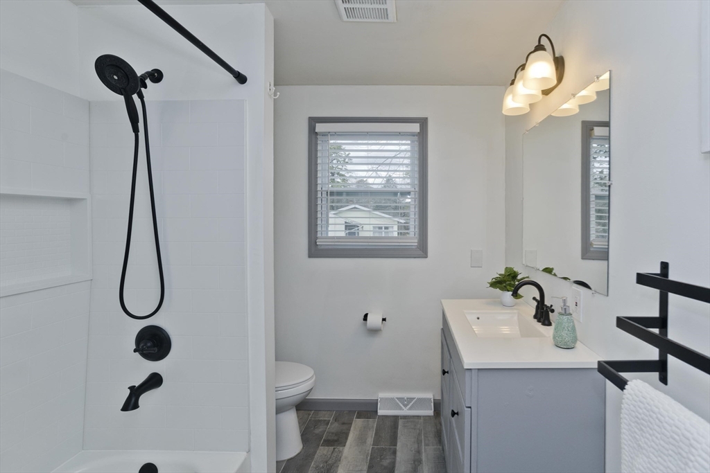 76 Paulk Terrace Springfield, MA 01128 - Photo 22 of 26 a bathroom with a sink a toilet and shower