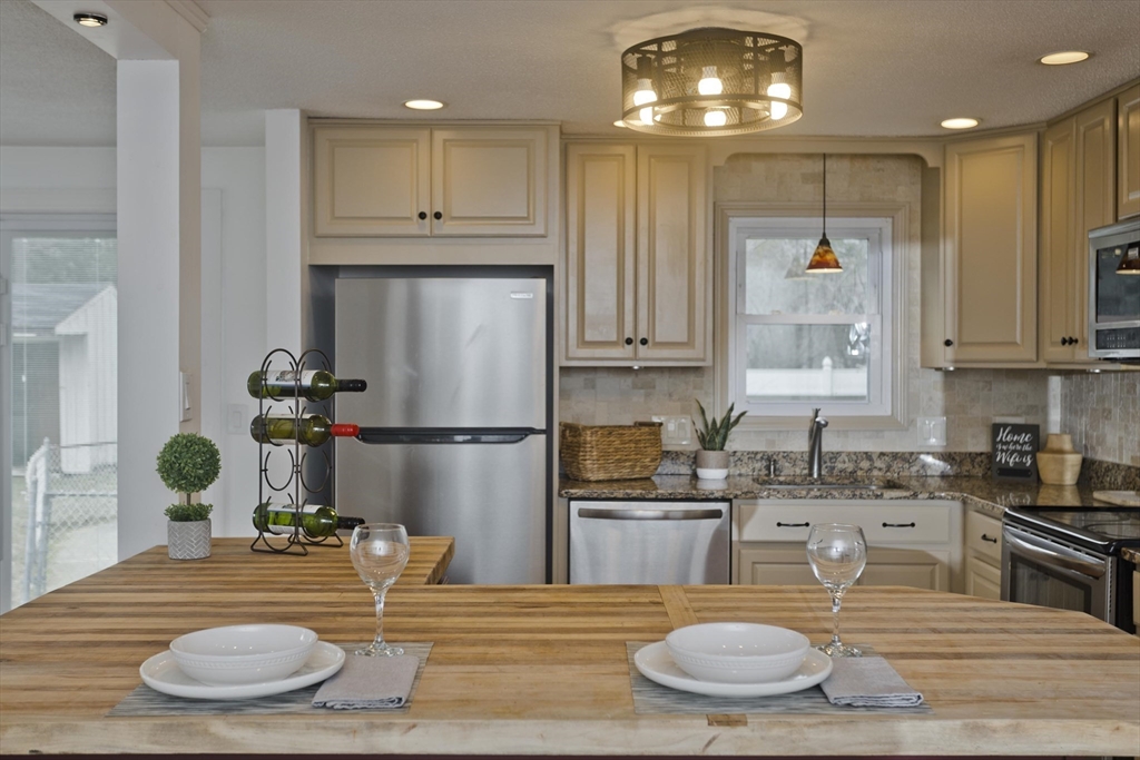 76 Paulk Terrace Springfield, MA 01128 - Photo 6 of 26 a kitchen with sink and refrigerator
