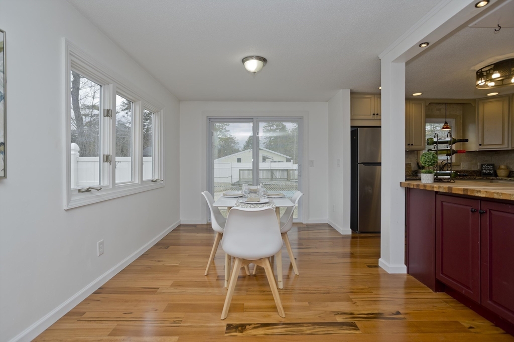 76 Paulk Terrace Springfield, MA 01128 - Photo 10 of 26 a view of kitchen with dining area and windows