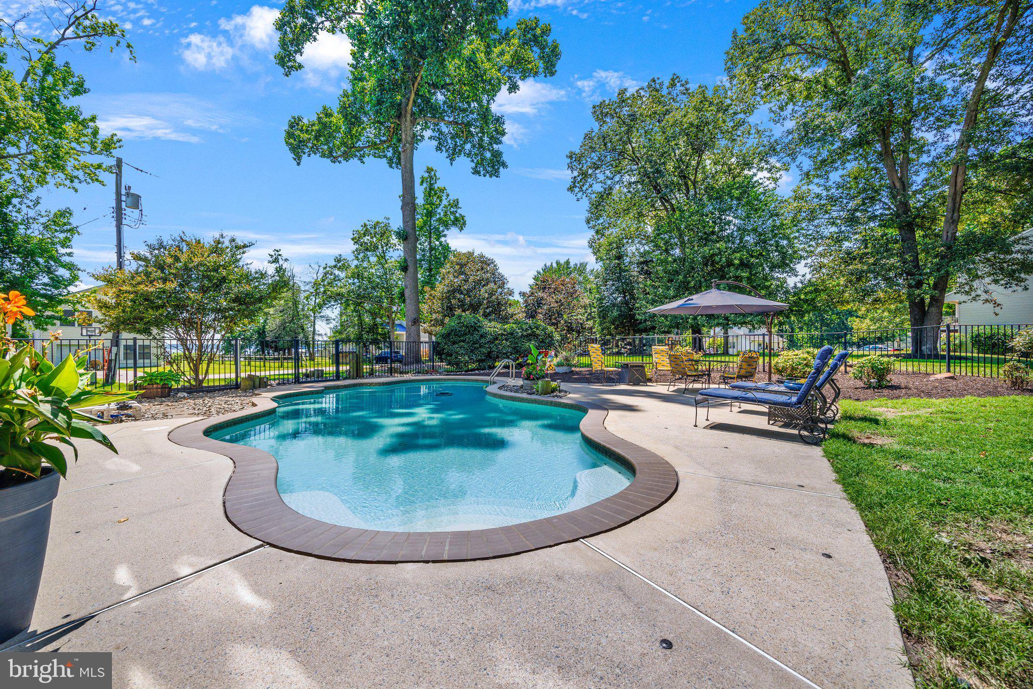 233 Circle Road Pasadena, MD 21122 - Photo 41 of 59 Pool area expands your entertaining space.