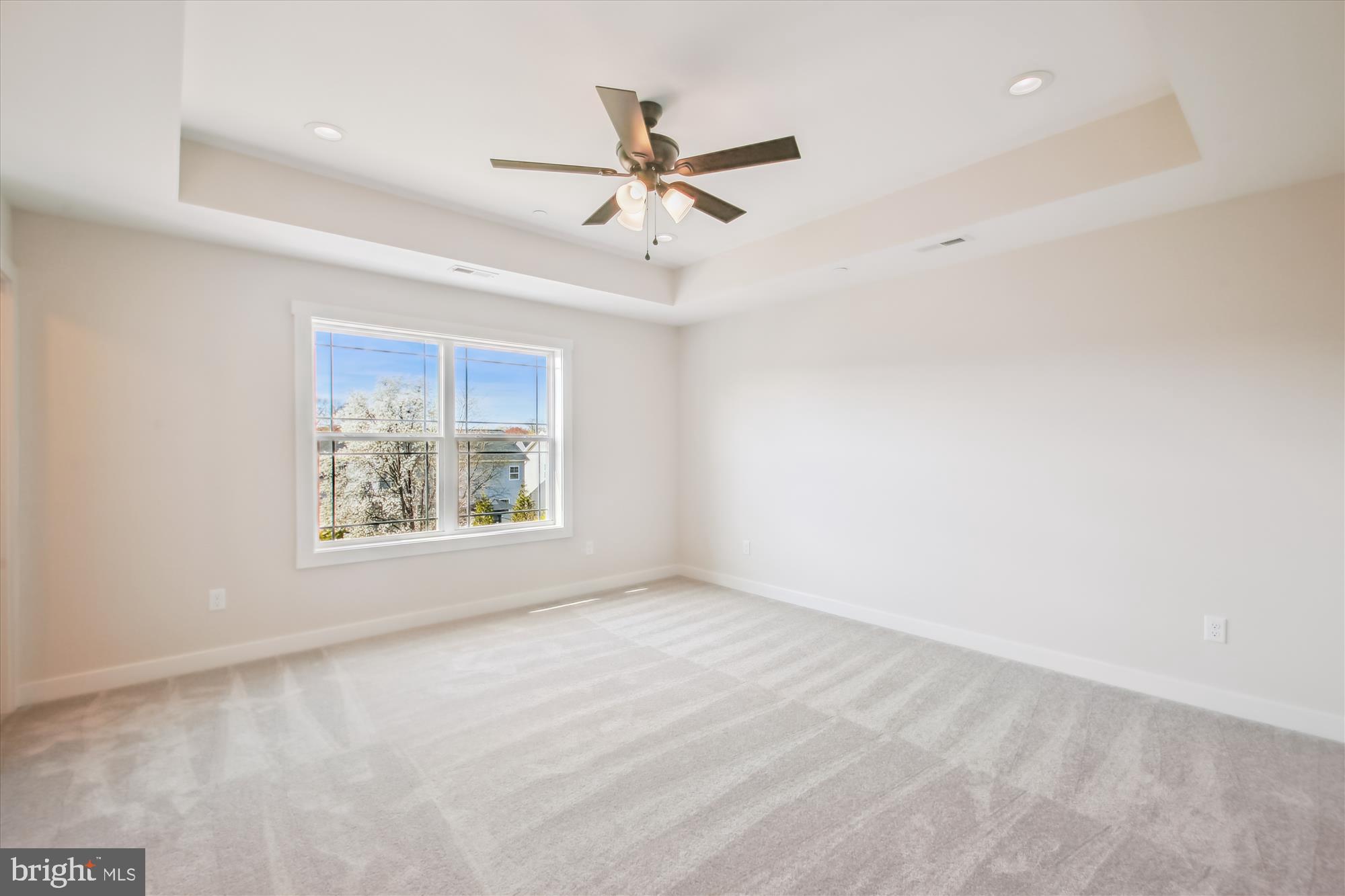 509 South Farm Crossing Road Severn, MD 21144 - Photo 21 of 35 an empty room with ceiling fan and windows