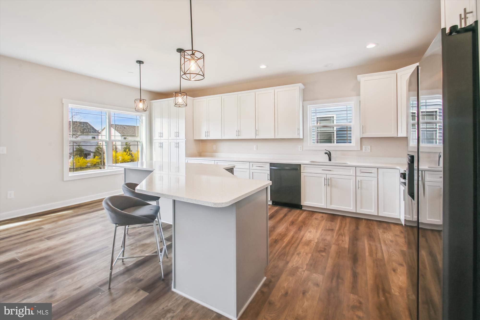 509 South Farm Crossing Road Severn, MD 21144 - Photo 5 of 35 a kitchen with a sink a center island cabinets and a window