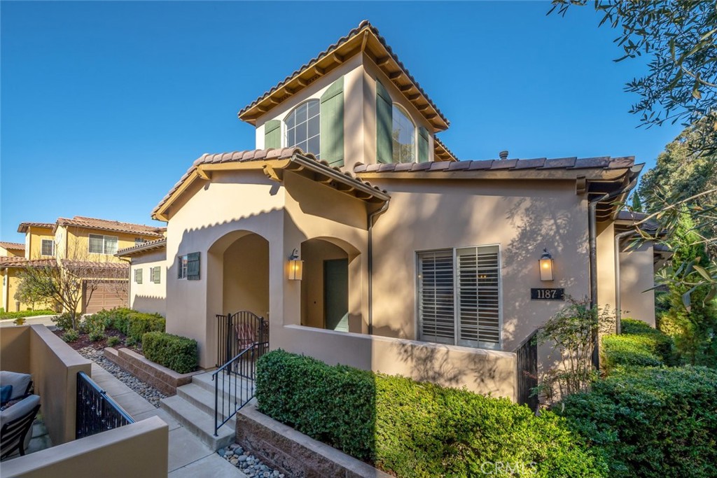 1187 Swallowtail Way Nipomo, CA 93444 - Photo 1 of 59 a front view of a house with garden