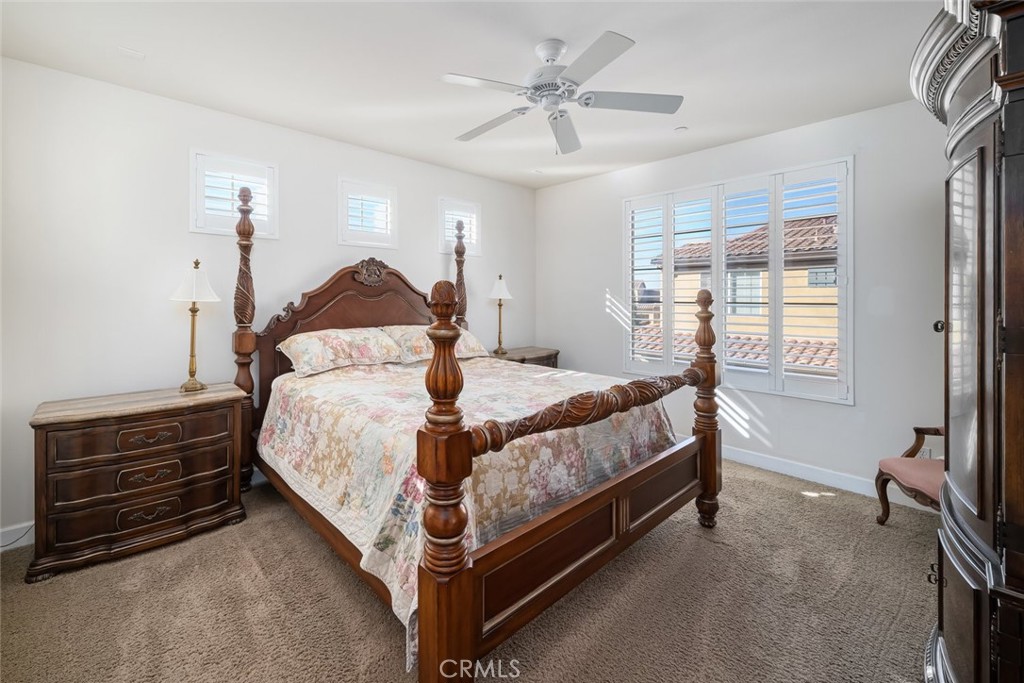 1187 Swallowtail Way Nipomo, CA 93444 - Photo 15 of 59 a bed sitting in a bedroom next to a window