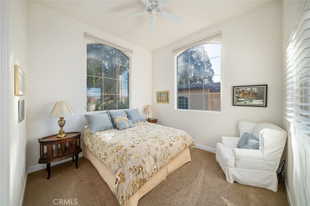 1187 Swallowtail Way Nipomo, CA 93444 - Photo 19 of 59 a bedroom with bed couch and window