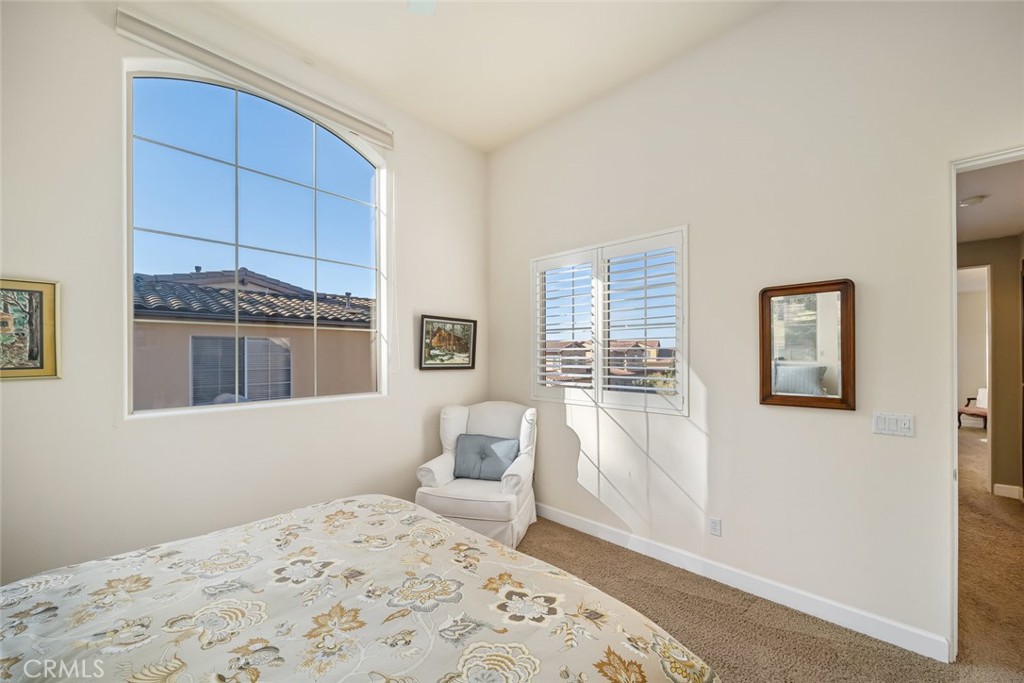 1187 Swallowtail Way Nipomo, CA 93444 - Photo 20 of 59 a bedroom with a bed and a window