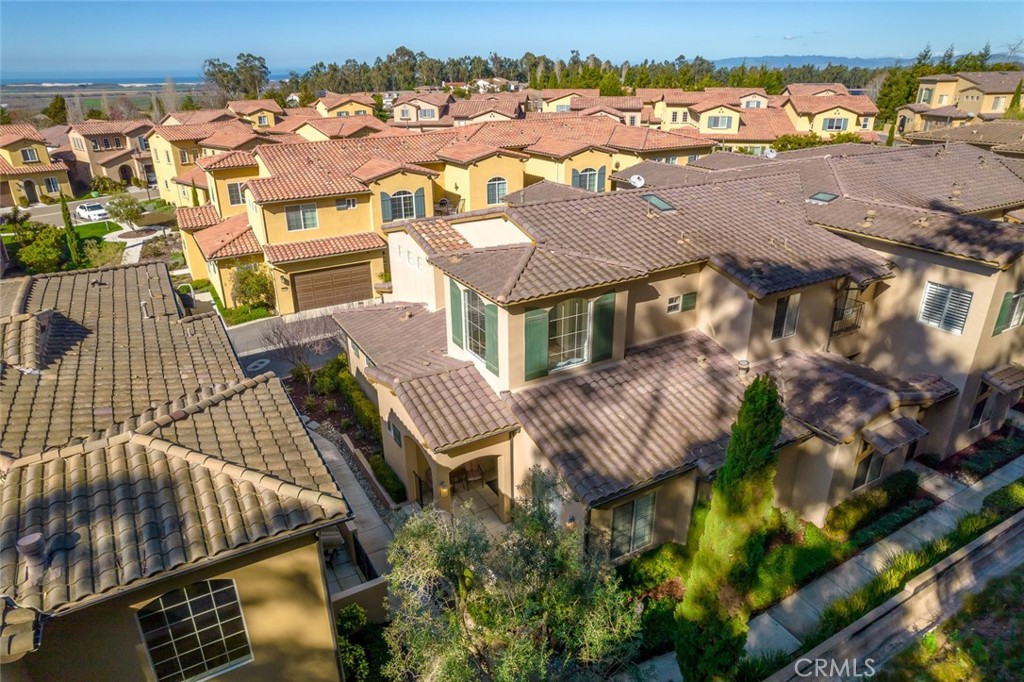 1187 Swallowtail Way Nipomo, CA 93444 - Photo 2 of 59 an aerial view of residential houses with outdoor space and parking
