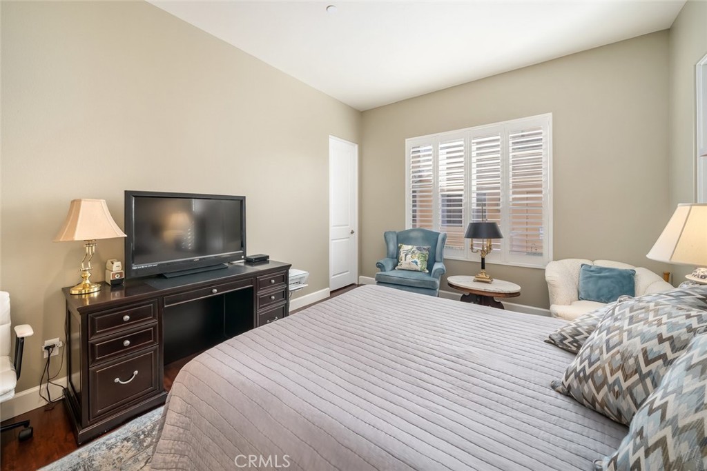 1187 Swallowtail Way Nipomo, CA 93444 - Photo 24 of 59 a bedroom with a bed and a flat screen tv