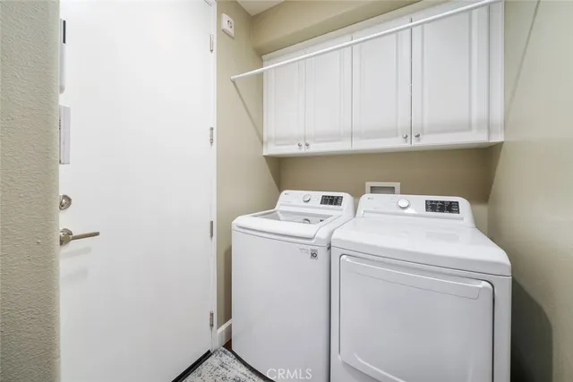 a view of a backyard with plants and water fountain