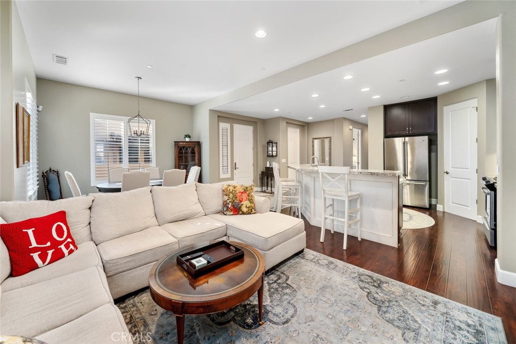 1187 Swallowtail Way Nipomo, CA 93444 - Photo 7 of 59 a living room with furniture and a wooden floor