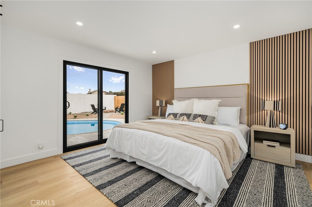 6072 Navajo Road Westminster, CA 92683 - Photo 11 of 26 a bedroom with a large bed and a window