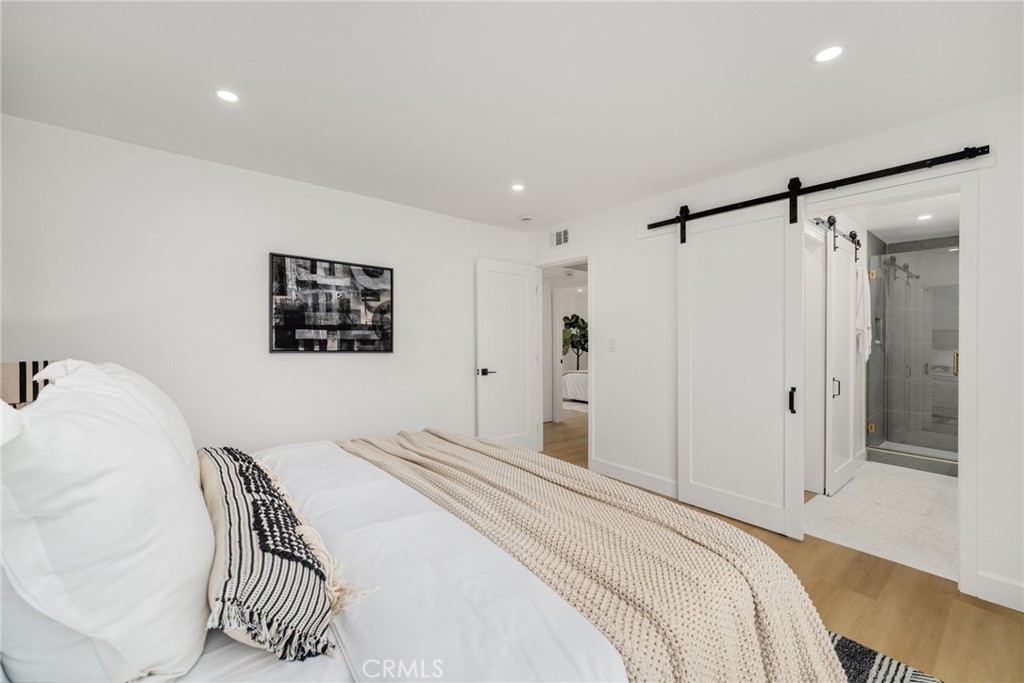 6072 Navajo Road Westminster, CA 92683 - Photo 12 of 26 a bedroom with a bed and a painting