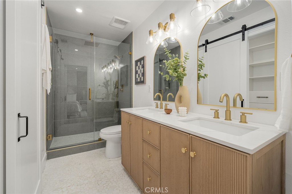 6072 Navajo Road Westminster, CA 92683 - Photo 13 of 26 a bathroom with a sink a toilet and shower