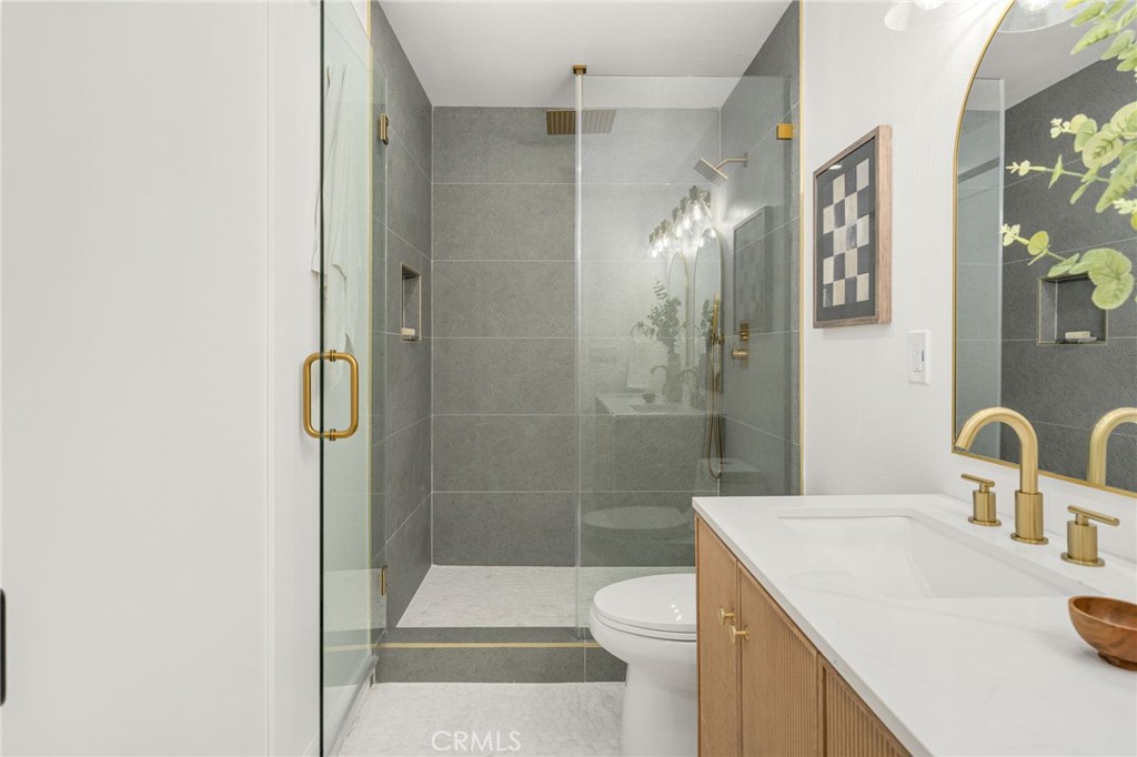 6072 Navajo Road Westminster, CA 92683 - Photo 14 of 26 a bathroom with a sink toilet and shower