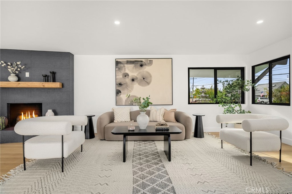 6072 Navajo Road Westminster, CA 92683 - Photo 4 of 26 a living room with furniture and a large window