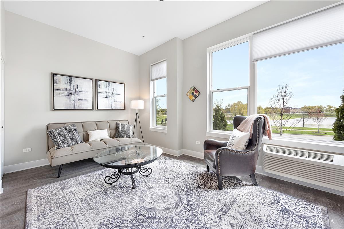 1101 Ritter Street, Unit 312 North Aurora, IL 60542 - Photo 5 of 14 a living room with furniture and a large window