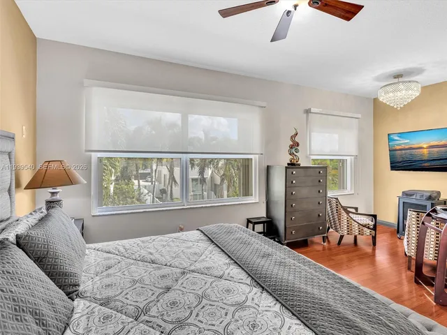 a bedroom with furniture and a window