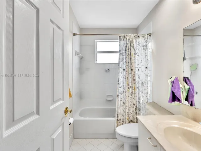 a bathroom with a toilet a sink and a bathtub