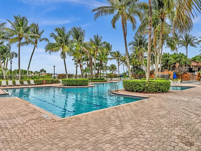 a backyard of a house with outdoor seating
