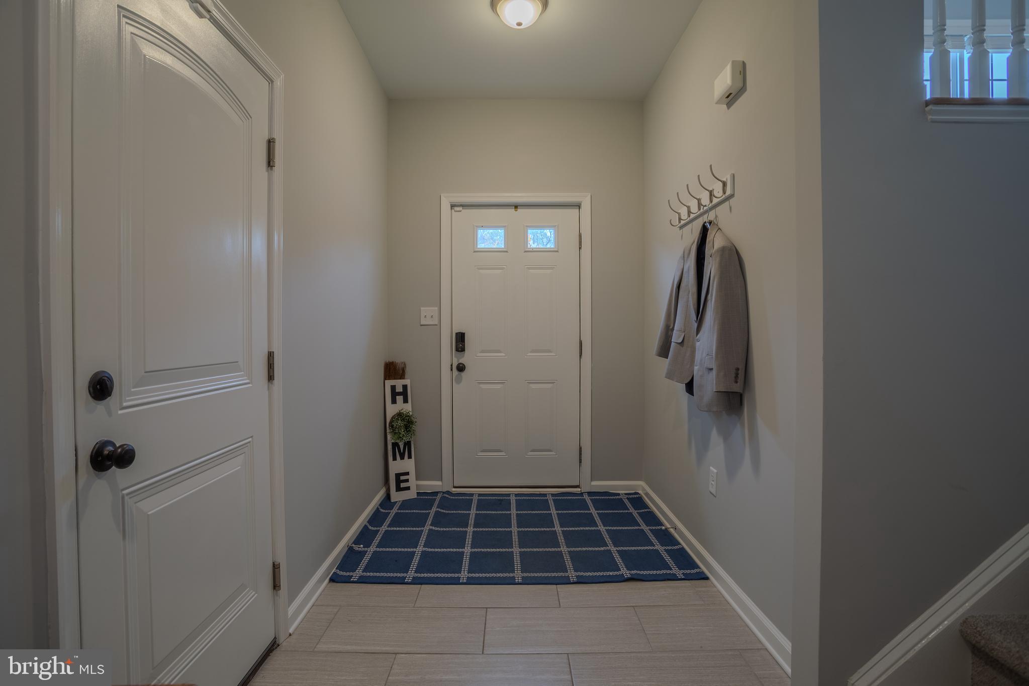 153 Dimension Road Inwood, WV 25428 - Photo 30 of 51 Entryway/ Foyer with Tiled Floor