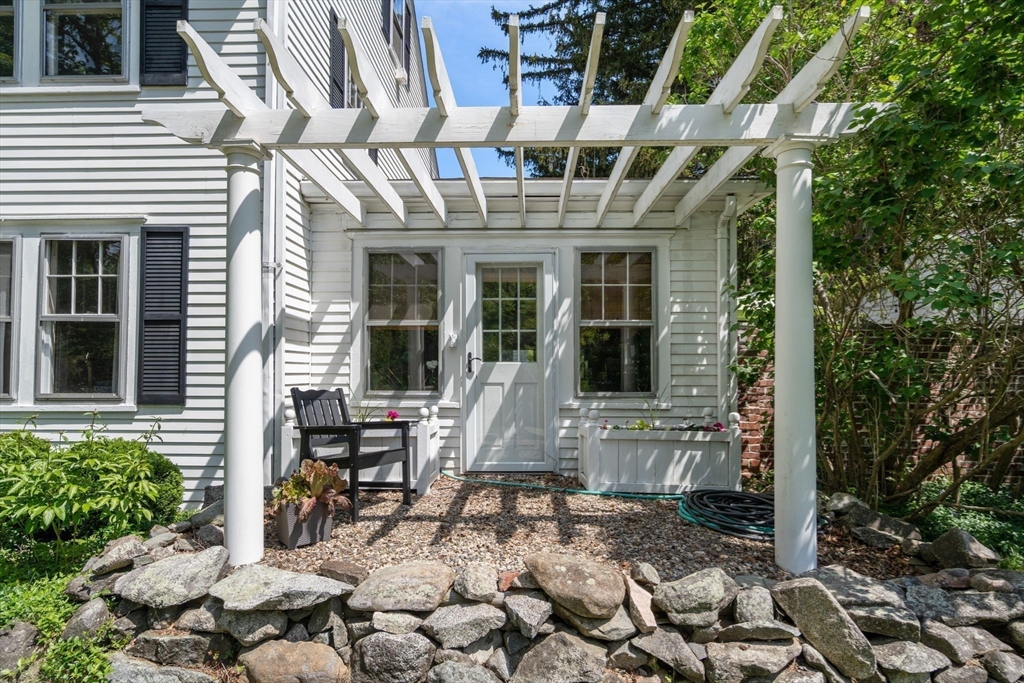 96 Hudson Road Sudbury, MA 01776 - Photo 33 of 42 front view of a building with a bench
