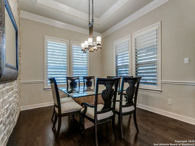 a dining room with furniture and window
