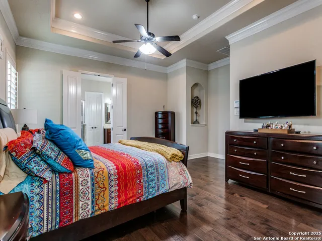 a bed room with a bed and a television