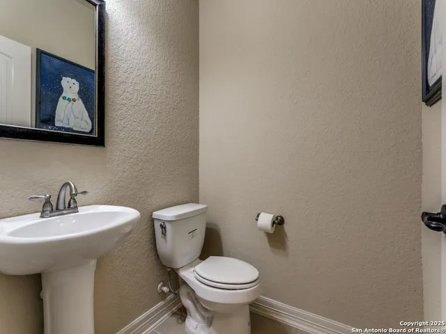 a bathroom with a toilet and a sink