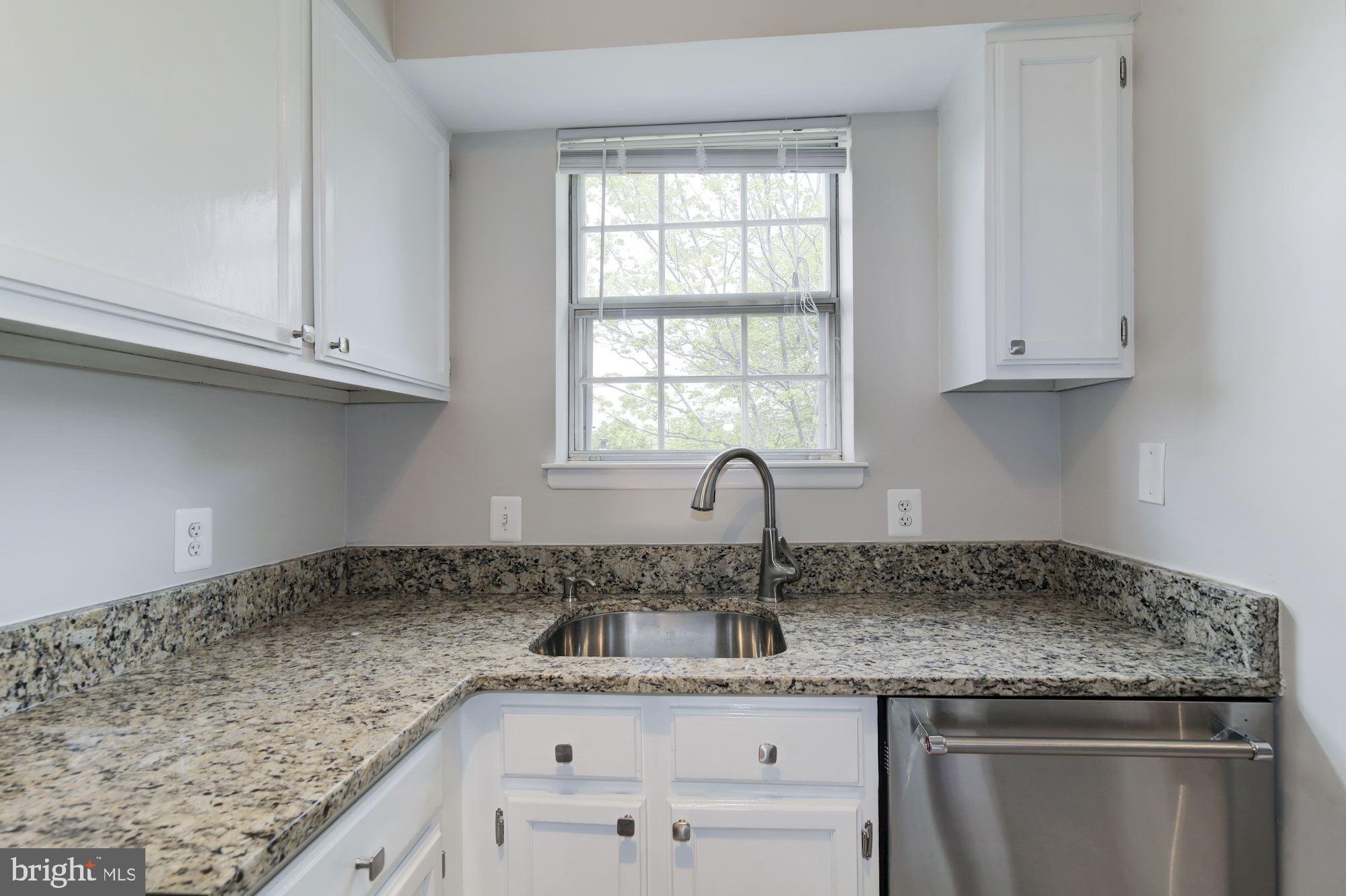 4626 B 28th Road South, Unit B Arlington, VA 22206 - Photo 11 of 22 a kitchen with granite countertop a sink and cabinets