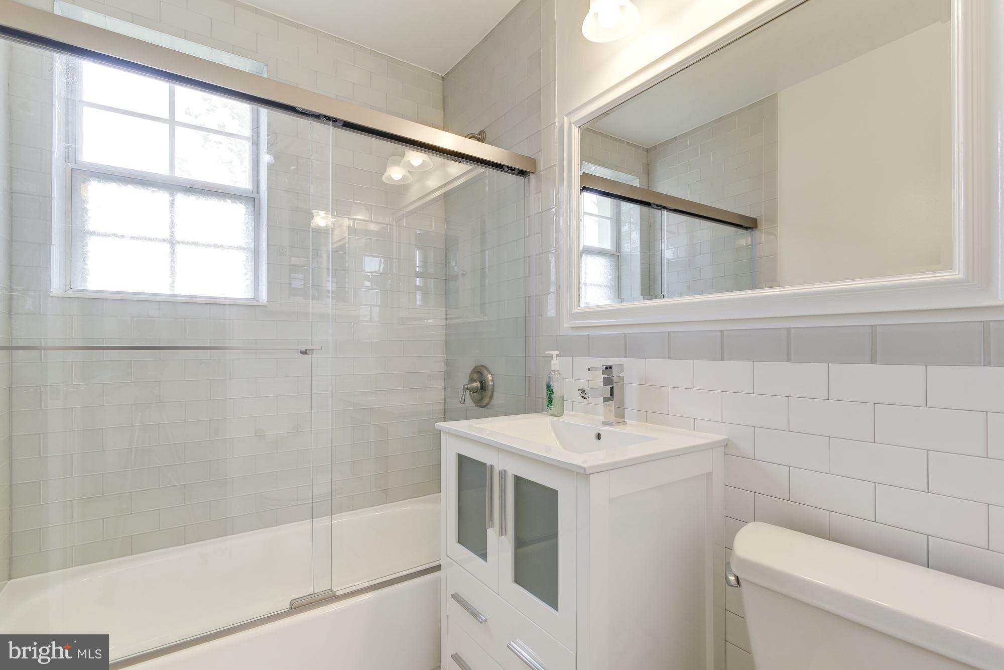 4626 B 28th Road South, Unit B Arlington, VA 22206 - Photo 17 of 22 a bathroom with a sink a toilet and shower