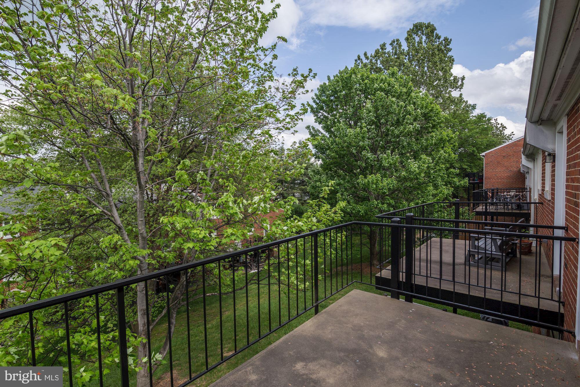 4626 B 28th Road South, Unit B Arlington, VA 22206 - Photo 20 of 22 a view of a balcony with floor to ceiling window and wooden fence